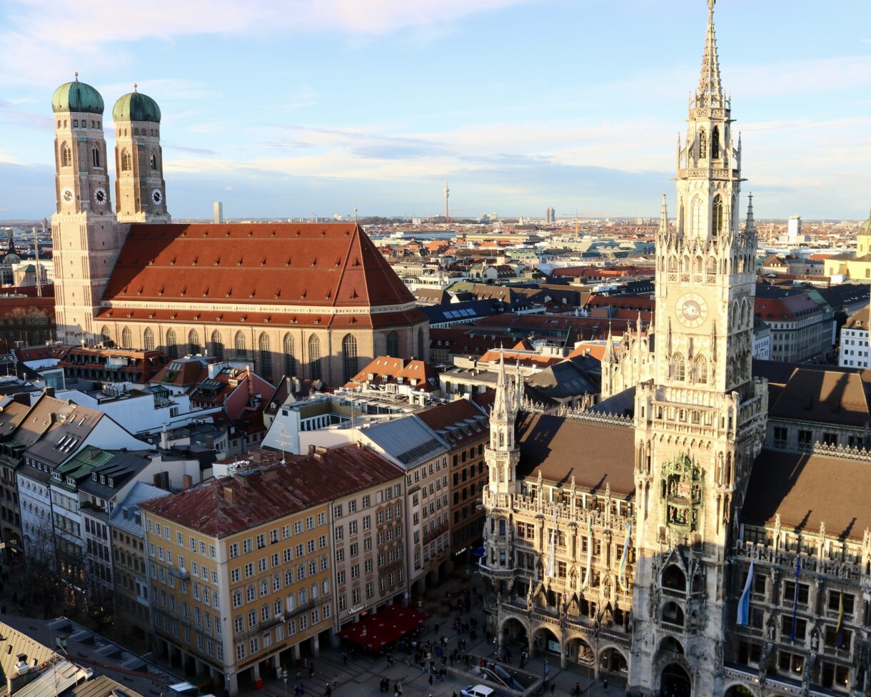 View from the tower of St. Peter church with the Frauenkirche (Cathedral of Our Dear Lady) on the left and the New City Hall on the right.