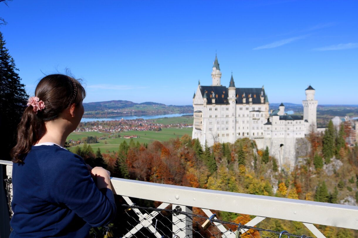 Tour guide Sonja Irani looking at Neuschwanstein Castle from the Marienbrücke in October