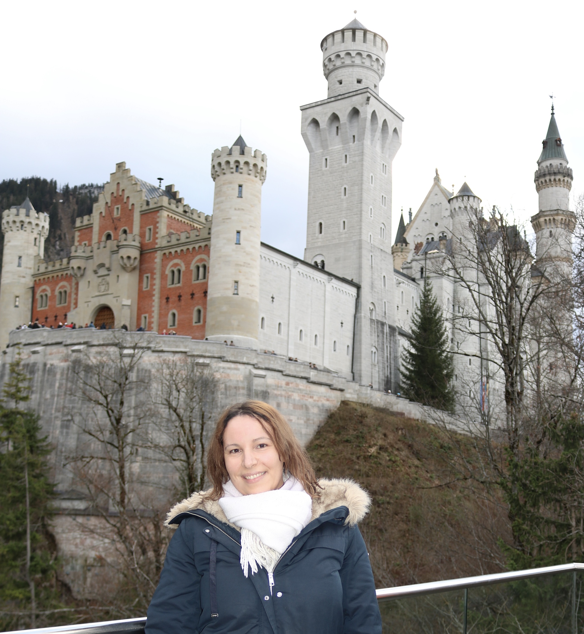 Tour Guide Sonja Irani in front of Neuschwanstein, Bavaria, Germany