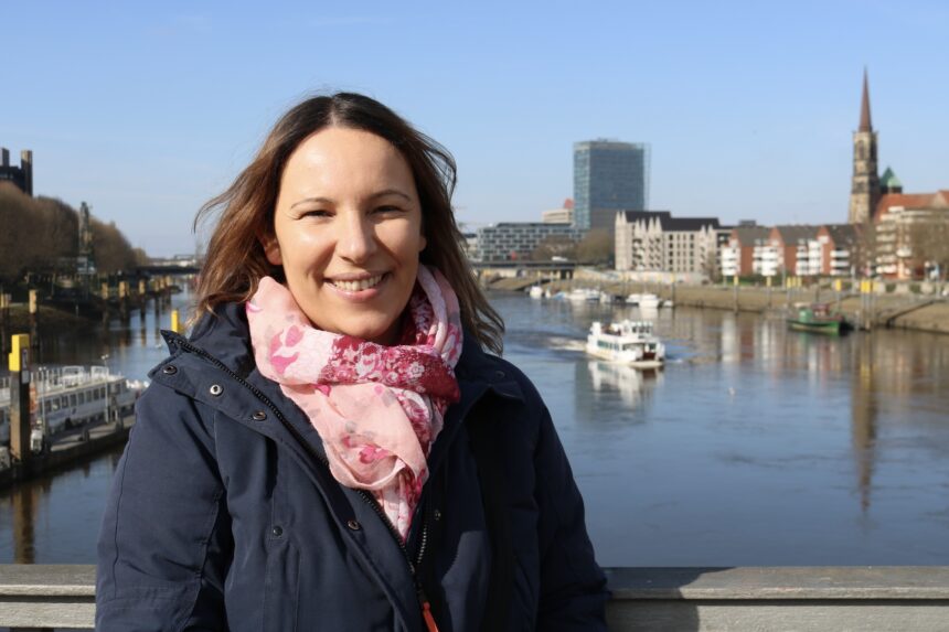 Tour Guide Sonja Irani at the river harbor front in Bremen, northern Germany